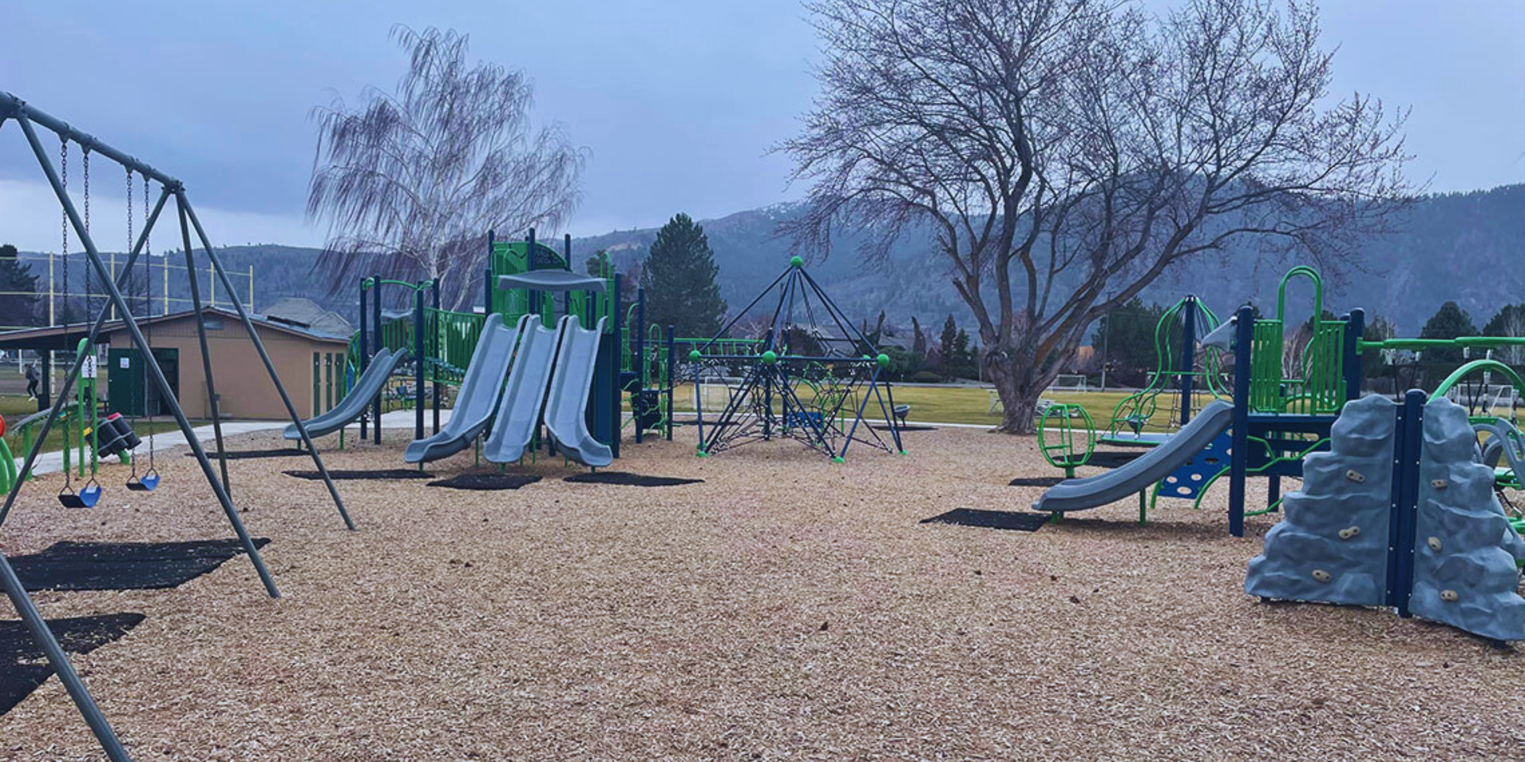 Playground in the Pacific Northwest with mountains in the background